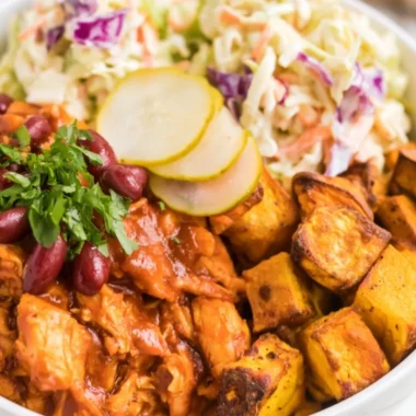 Delicious BBQ chicken bowls garnished with vegetables and sauce