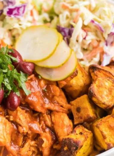 Delicious BBQ chicken bowls garnished with vegetables and sauce