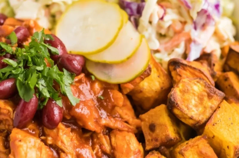 Delicious BBQ chicken bowls garnished with vegetables and sauce