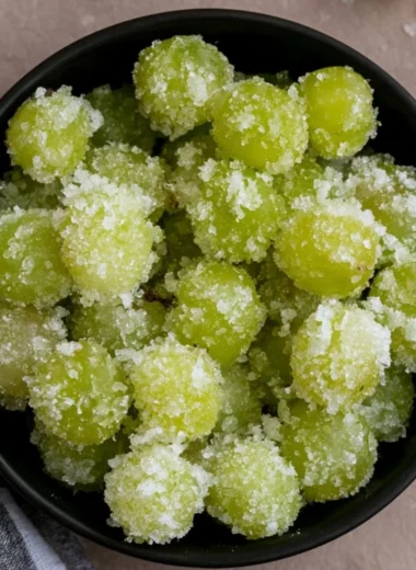 A bowl of candied frozen sour grapes ready to be enjoyed as a sweet snack