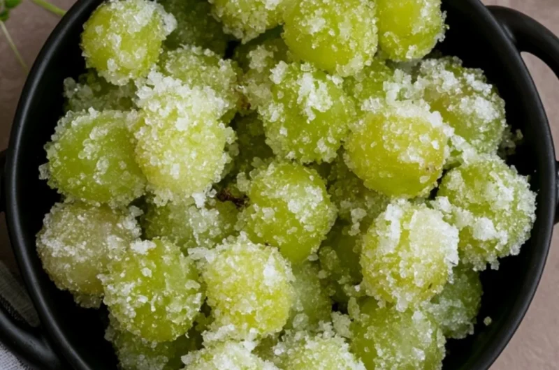 A bowl of candied frozen sour grapes ready to be enjoyed as a sweet snack
