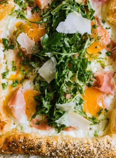 Cozy baked prosciutto and egg breakfast tart on a plate
