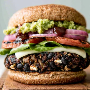 Cozy homemade black bean burgers served with fresh toppings