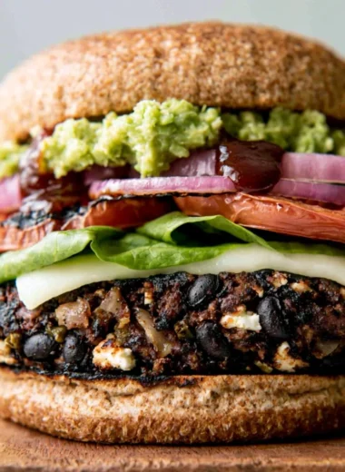Cozy homemade black bean burgers served with fresh toppings