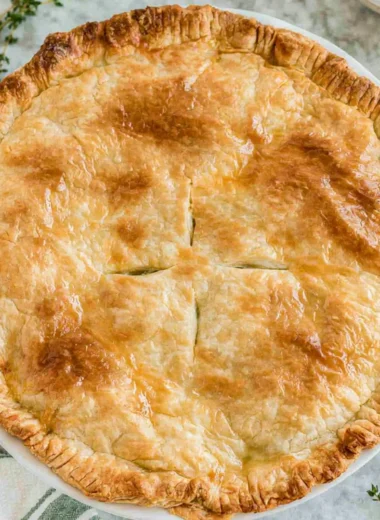 Cozy Chicken Pot Pie with flaky crust and savory filling of chicken and vegetables.