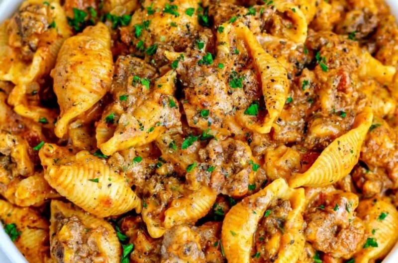 Delicious bowl of creamy beef and shells topped with parsley