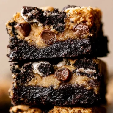 Cozy Oreo Brookies topped with Oreo cookies and chocolate chips