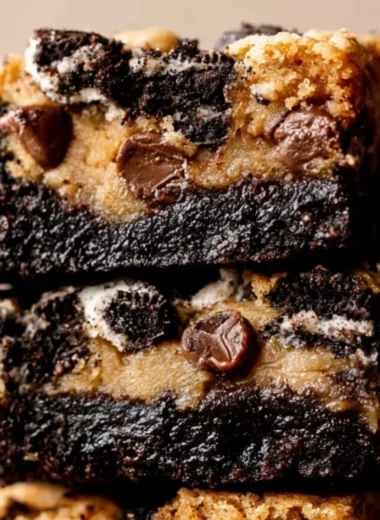 Cozy Oreo Brookies topped with Oreo cookies and chocolate chips