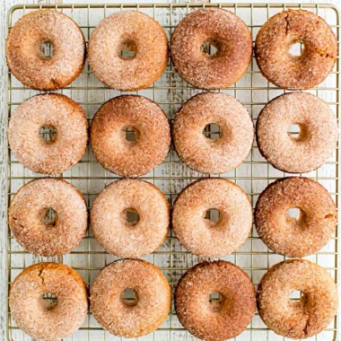 Cozy pumpkin spice donuts topped with cinnamon for a fall treat