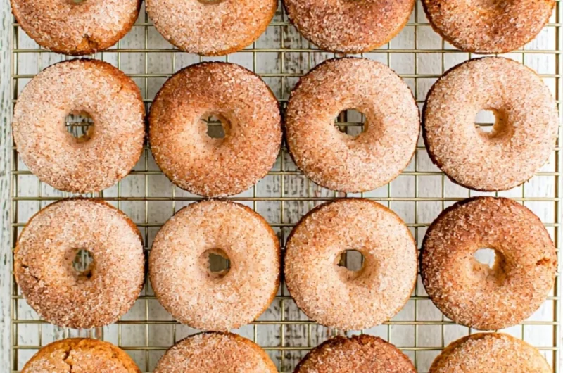 Cozy pumpkin spice donuts topped with cinnamon for a fall treat