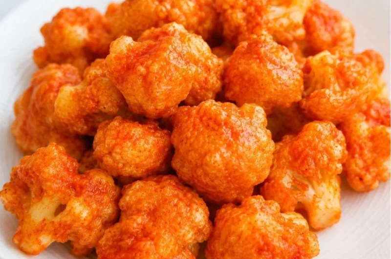 Delicious vegan cauliflower nuggets served with a dipping sauce