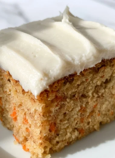 Delicious dairy-free carrot cake topped with cream cheese frosting
