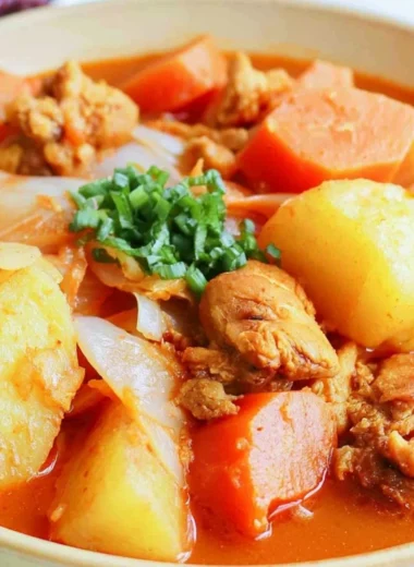 Delicious Dakbokkeumtang Korean chicken stew garnished with herbs and vegetables.