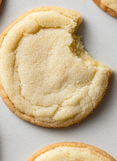 Plate of easy soft and chewy sugar cookies fresh out of the oven