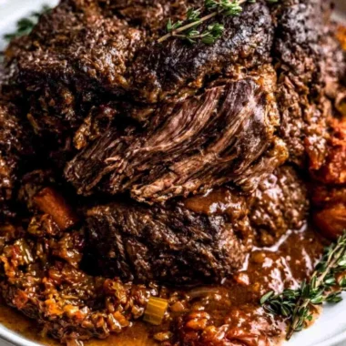 Ina Garten's Company Pot Roast served with vegetables and gravy