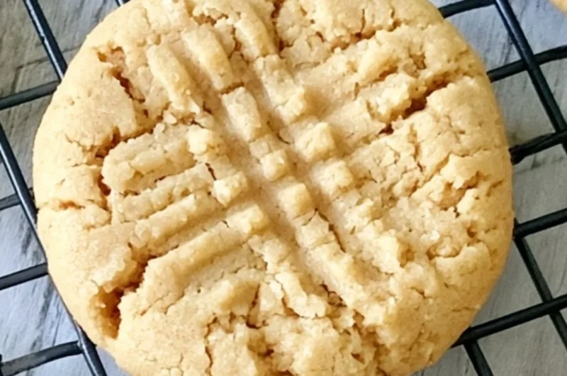 Batch of soft peanut butter cookies cooling on a wire rack
