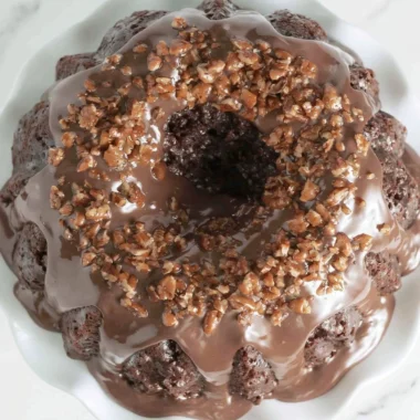 Delicious Texas Sheet Cake Bundt Cake with chocolate frosting and nuts