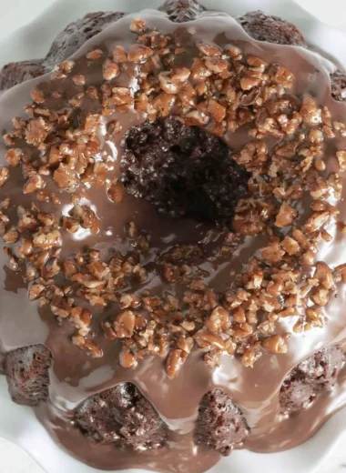 Delicious Texas Sheet Cake Bundt Cake with chocolate frosting and nuts