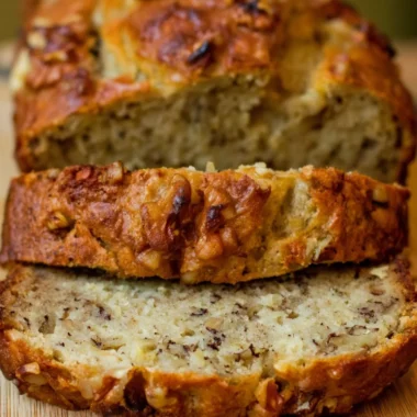 Freshly baked Bourbon Banana Walnut Bread with walnuts and bourbon glaze.