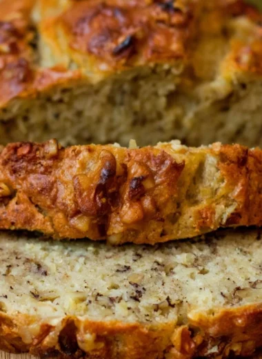 Freshly baked Bourbon Banana Walnut Bread with walnuts and bourbon glaze.