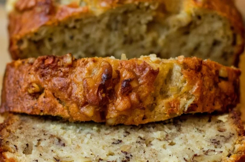Freshly baked Bourbon Banana Walnut Bread with walnuts and bourbon glaze.