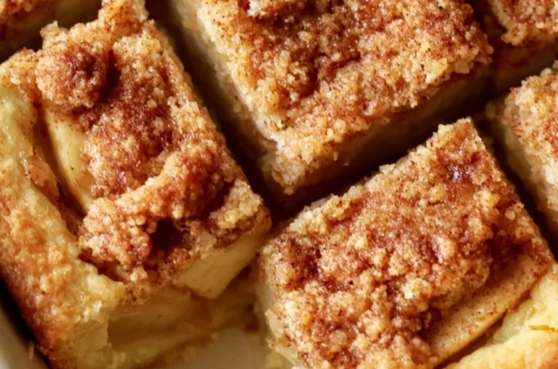 Delicious cozy apple pie bars served with caramel drizzle and cinnamon on top.