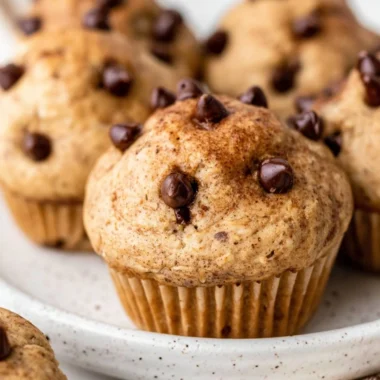 Cozy cottage cheese muffins with chocolate chips on a wooden table