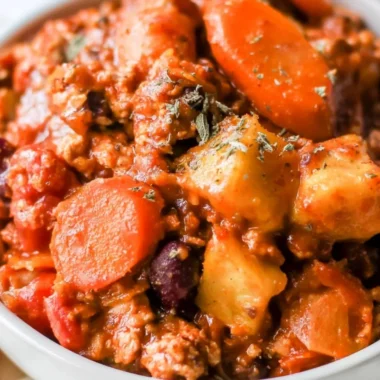 Cozy Turkey Apple Chili served in a bowl with garnishes