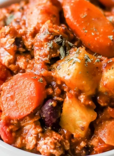 Cozy Turkey Apple Chili served in a bowl with garnishes