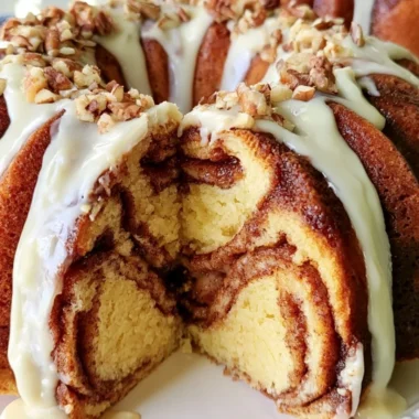 Easy Cinnamon Roll Bundt Cake with icing on a serving plate