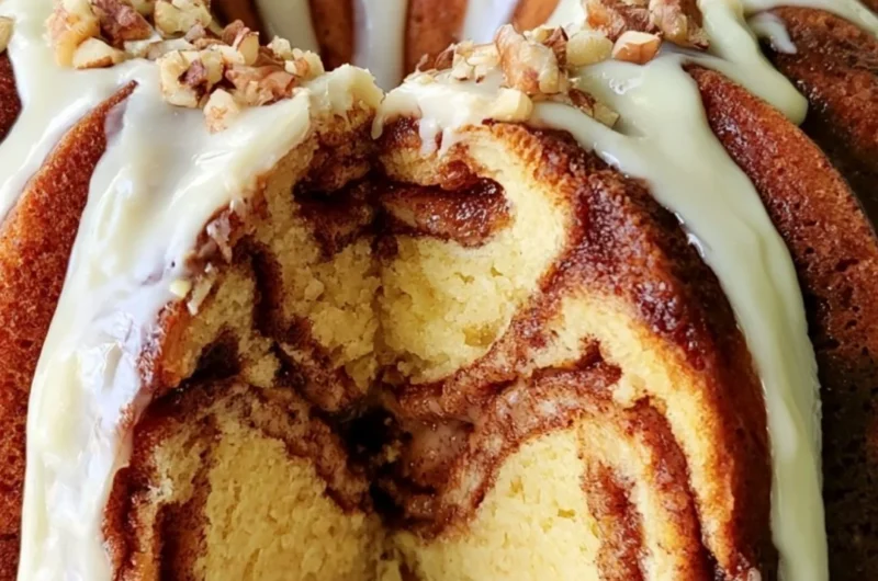 Easy Cinnamon Roll Bundt Cake with icing on a serving plate