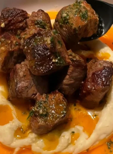 Delicious Cowboy Butter Steak Bites topped with caramelized onions