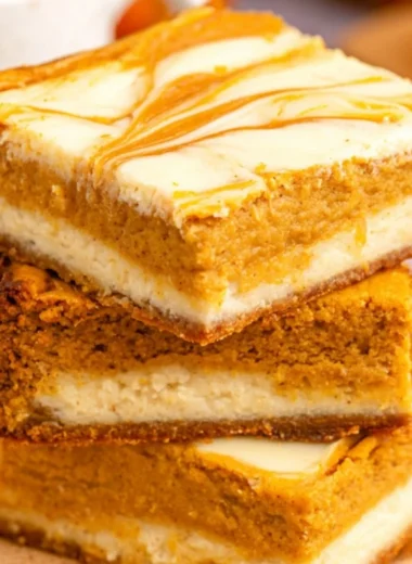 Cozy Pumpkin Cream Cheese Cheesecake Bars topped with fall spices