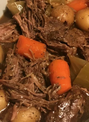 Easy slow cooker pot roast with vegetables served on a plate