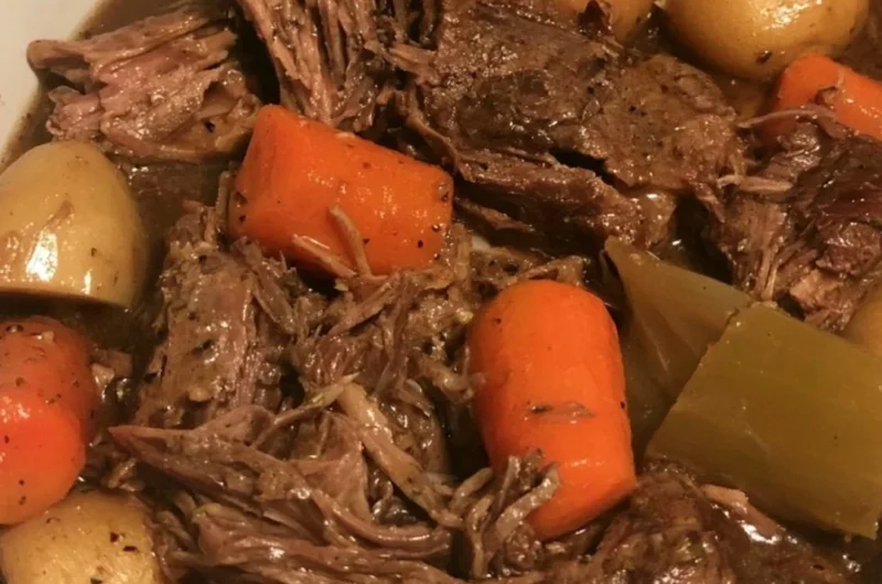 Easy slow cooker pot roast with vegetables served on a plate