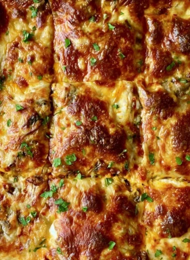 Invisible butternut squash, spinach, and mushroom lasagna slice on a plate.